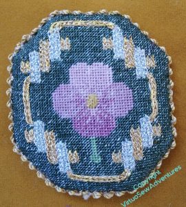 The Pansy finished as a pad, edged with Silk Serpentine Gimp.