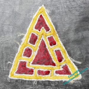 Small stitched version of an anglo-saxon jewel, using the trapunto quilting technique