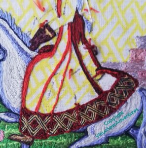 Close up of the restarted stitching on Aethelflaed's dress, beginning this time with the lightest colour.