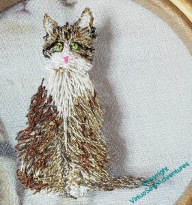 More layers of stitching on the cat, more sense of the warm, darker colours on one side, lighter fawn on the other.