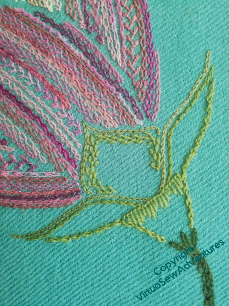 The calyx of the second half open flower, also quite lightly stitched