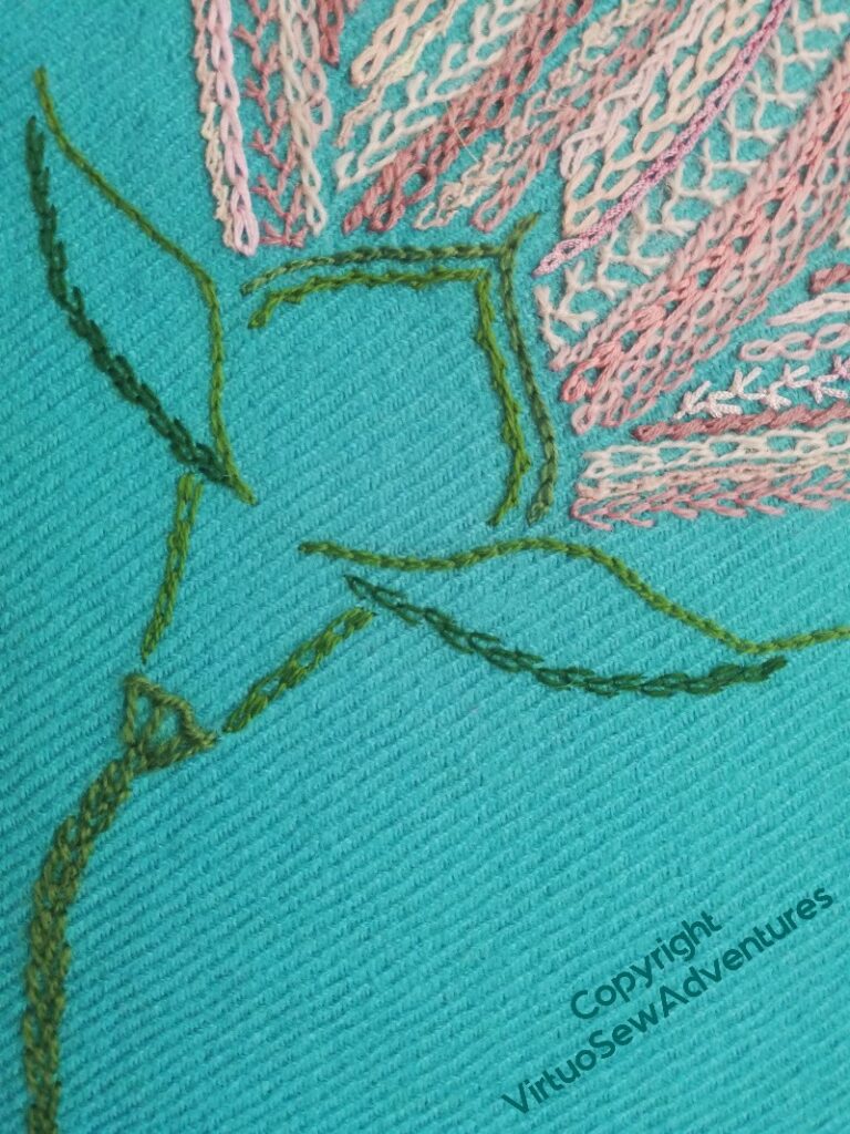 Relatively light stitching on the calyx of one of the half open flowers