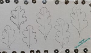 Layout of cotton fabric with rough oak leaves drawn on it.